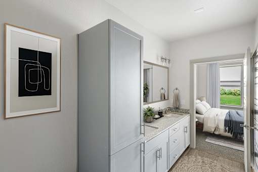 Bathroom vanity with granite countertop and bedroom view at The Westerly Apartments, Midlothian, 76065
