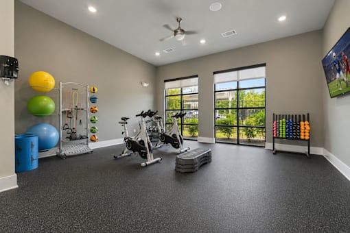 Spacious fitness center with cardio and strength-training equipment at Auberge of Tyler.