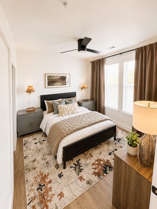 Spacious primary bedroom with natural light at The Bluewood
