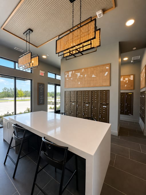 Convenient resident mail room with  package lockers.