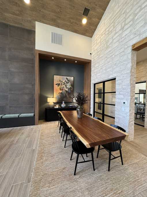 Spacious clubhouse lounge featuring comfortable seating, fireplace and social spaces.