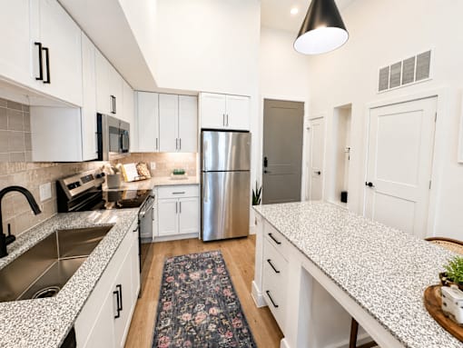 Luxury kitchen with pendant lighting at The Bluewood