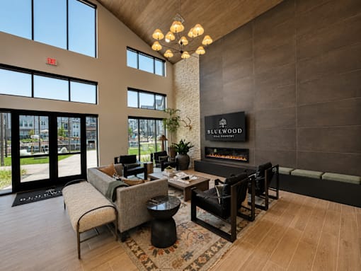 Spacious resident clubhouse with gathering spaces, work areas and coffee bar.