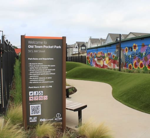 A sign welcoming visitors to Old Town Pocket Park on Sill M. Street.