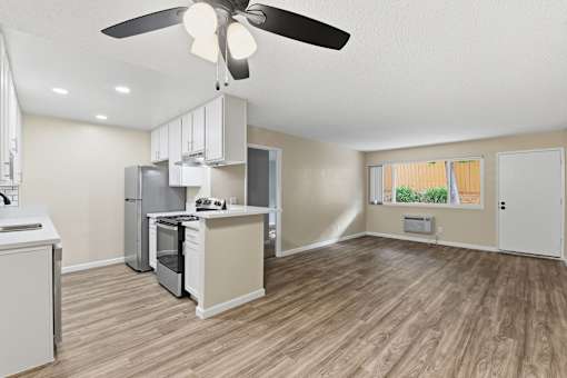 Our 'Premium' 2 Bedroom 2 Bath Apartment Kitchen & Living Room at Vista Flores Apartments