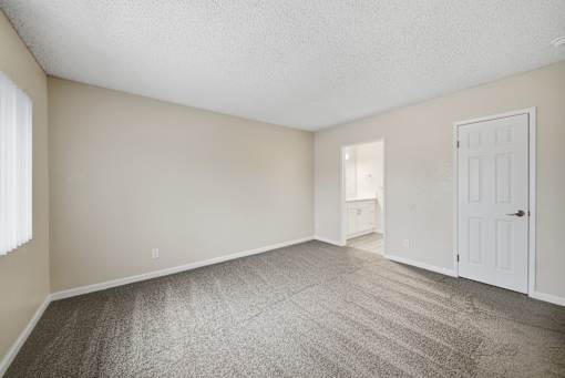 A Primary Bedroom at Midway Gardens Apartments