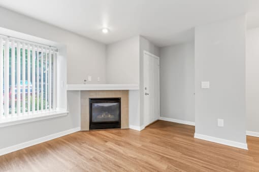 A Living Room with a Fireplaceat The Buttes Apartments, Colorado, 80537