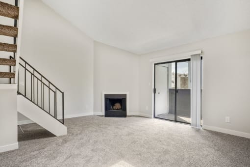 A living room with a fireplace and loft at Hilltop View Apartments