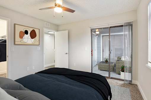 A Bedroom leading to Private Balcony at Horizon East Apartments
