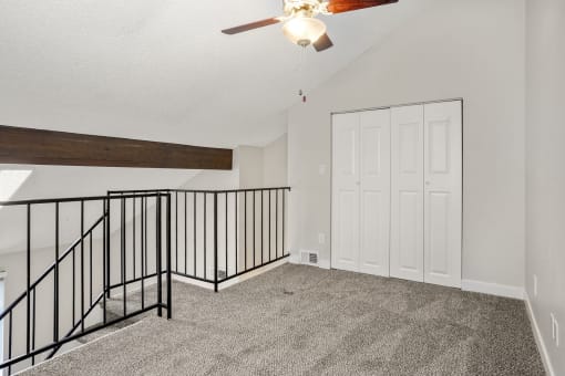 An upstairs loft with closet at Hilltop View Apartments