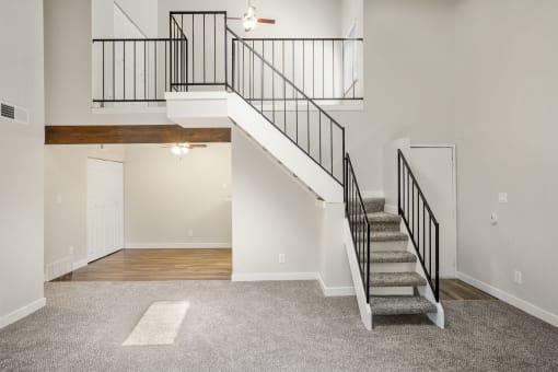 A living room with loft at Hilltop View Apartments