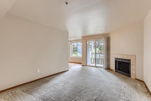 A Living Room with a Fireplace at Ladera Apartments