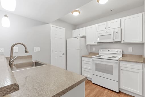 A Kitchen at The Buttes Apartments, Loveland, CO 80537