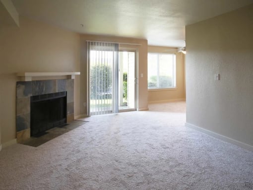 A Living Room with a Fireplace at Ladera Apartments
