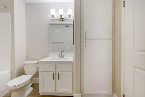 Each bathroom features sleek cabinetry, contemporary fixtures, and stunning tile work, creating a spa-like atmosphere.