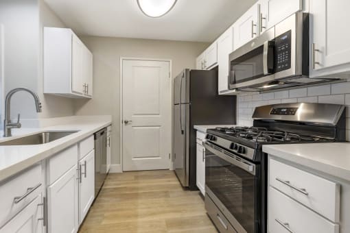 Featuring sleek stainless steel appliances, including a spacious refrigerator and a convenient dishwasher, these kitchens are designed for both cooking and entertaining.