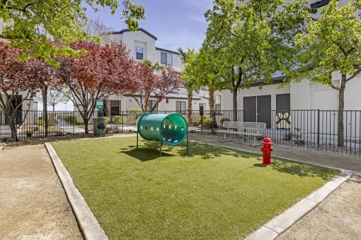 Unleash the ultimate in pet-friendly luxury at The Michael B! Our gated dog park offers a serene retreat with shaded trees and a cozy bench for you and your furry friend to relax and enjoy the day.at