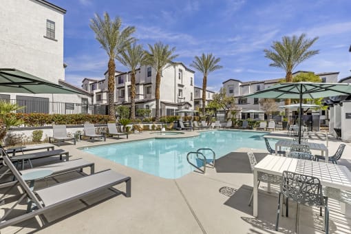 Dive into luxury living at Michael B Apartments, where every day feels like a vacation with our resort-style pool and inviting lounge area.at The Michael B Townhomes and Flats, Nevada