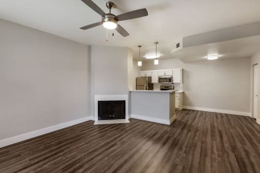 Enjoy the cozy ambiance of our living room, complete with a crackling fireplace at Boulders at Lookout Mountain Apartment Homes, Arizona 