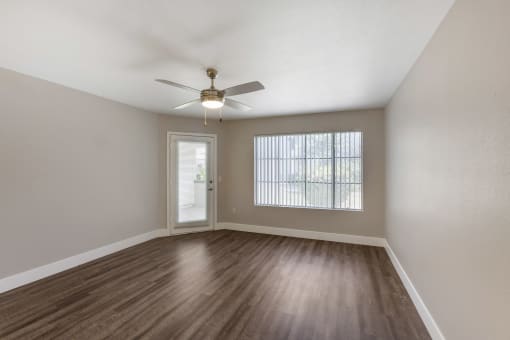 A welcoming living space with direct access to a serene patio or balcony at Boulders at Lookout Mountain Apartment Homes, Phoenix Arizona
