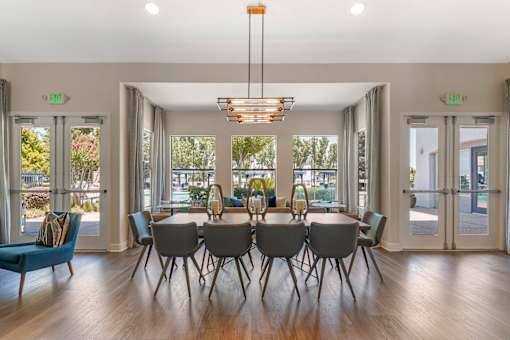 The clubhouse features large tables ideal for gatherings, whether you're hosting a small get-together, working on a project, or enjoying a meal with friends at Ascent at the Galleria.