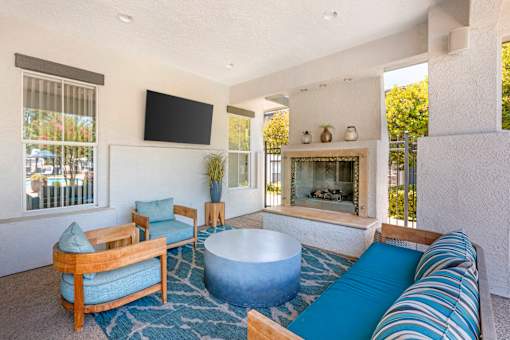 Our scenic pool deck features a large pool, jacuzzi, two propane grills, plenty of seating, and a covered lounge with a cozy fire pit—perfect for year-round relaxation at Ascent at the Galleria.