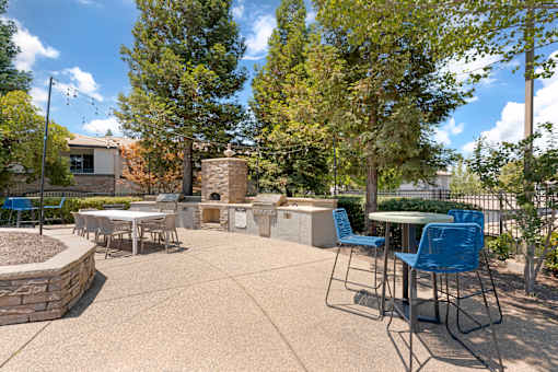 Our tree-lined pool deck features a large pool, jacuzzi, two propane grills, plenty of seating, and scenic views—steps from the clubhouse and leasing office at Ascent at the Galleria.