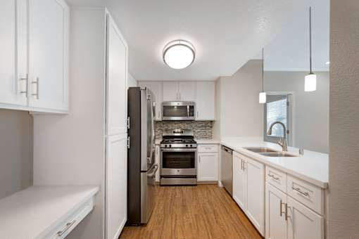 Our renovated kitchens shine with stainless steel appliances, upgraded fixtures, and sleek quartz countertops—designed for style and functionality in every Ascent at the Galleria home.