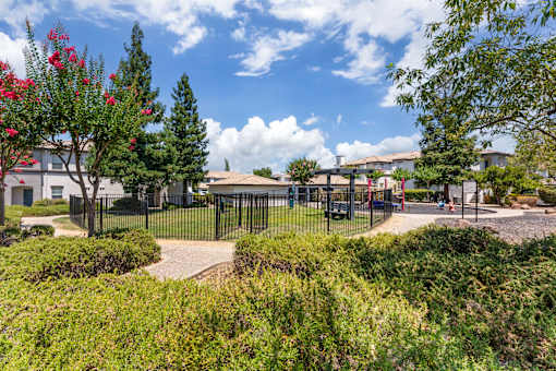 The gated dog park is conveniently located right next to the playground, allowing both kids and pets to enjoy fun and playtime close by at Ascent at the Galleria.