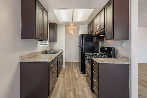 Sedona Apartments in Moreno Valley offers renovated units with updated flooring, sleek black appliances, and modern cabinets for stylish, comfortable living.