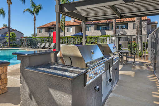 Sedona Apartments in Moreno Valley features a renovated pool deck with a gazebo and gas grills—perfect for relaxing and entertaining outdoors.