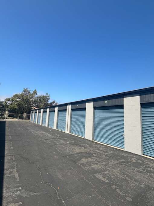 the side of a building with roll up garage doors