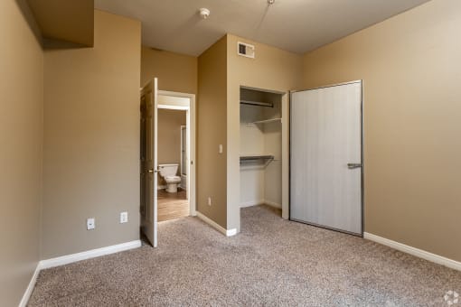 The master bedroom features a fully renovated en-suite bathroom and plush carpeting, creating a fresh and comfortable retreat.at The Hills at Quail Run, CA, 92507