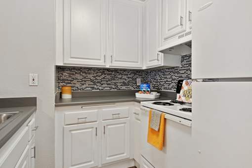 Spacious kitchen with pantry cabinet at Twenty 2 Eleven Apartment Homes, CA, 91306