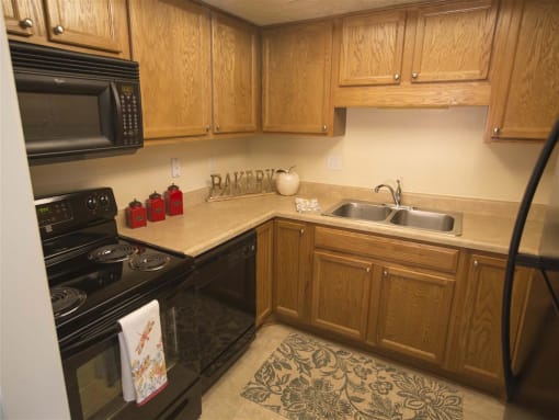 Apartment Kitchen with All New Black Appliances