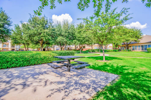 Huge courtyard with BBQ Grills at Tuscany Square Apartments in North Dallas, TX. Now leasing studios, 1 and 2 bedroom apartments.
