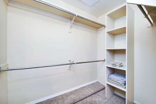 Built in shelves in walk in closet at Ventana Apartment Homes in Central Scottsdale, AZ, For Rent. Now leasing 1 and 2 bedroom apartments.