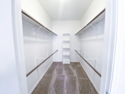 Oversized walk in closet at Tuscany Square Apartments in North Dallas, TX. Now leasing studios, 1 and 2 bedroom apartments.