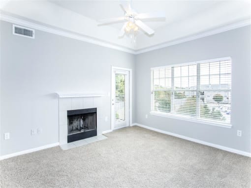 Fireplace in bright living room of Estancia Apartments For Rent Tulsa OK - 1, 2 , and 3 Bedroom Units Available