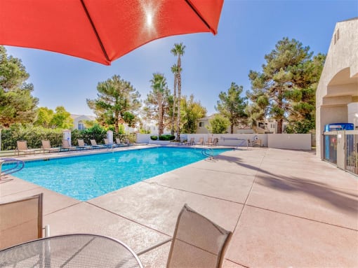Resort pool umbrella at Country Club at Valley View Senior Apartments in Las Vegas, NV, For Rent. Now leasing 1 and 2 bedroom apartments.