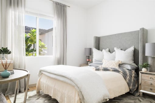 a bedroom with a bed and a window at Villas on Ash, Gilbert, AZ 85234  