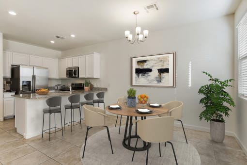 Dining area and kitchen with room for bar top seating at Casa Sole Vita Townhomes, Mesa, AZ