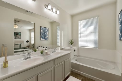 Dual sink vanity in master bathroom with soaking tub at Casa Sole Vita Townhomes, Arizona