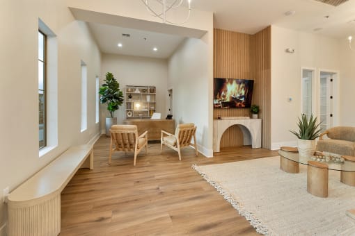 a living room with a fireplace and a table and chairs at Villas on Ash, Arizona, 85234