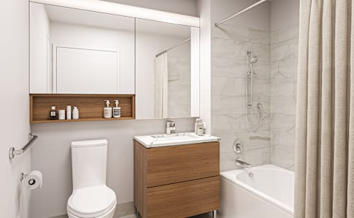 a bathroom with a toilet sink and bathtub in a 555 waverly unit