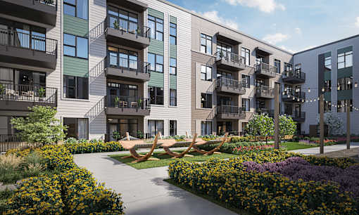 an apartment building with a sculpture of a boat in front of it at Link Apartments® Broad Ave, Memphis