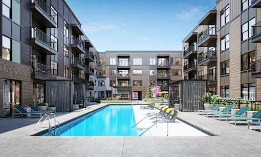 a swimming pool in the middle of an apartment building at Link Apartments® Broad Ave, Memphis