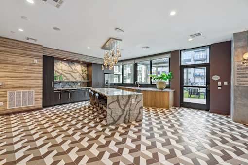 the lobby of a hotel with a marble bar and a checkered floor at Link Apartments® Broad Ave, Memphis, Tennessee