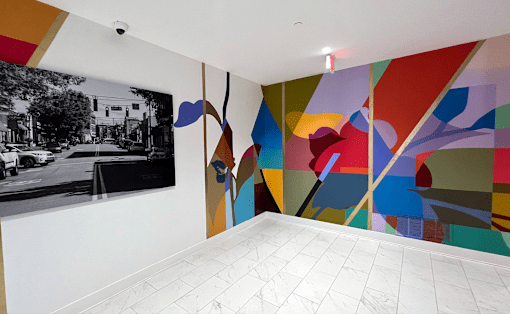 Large Muraled Walls with a black and white photo on the wall at Link Apartments 4th Street in Winston-Salem, NC