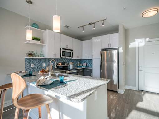 Fitted Kitchen With Island Dining at Link Apartments® Glenwood South, Raleigh, NC, 27603